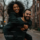 Joyful Couple Enjoying a Playful Piggyback Ride on Urban Street