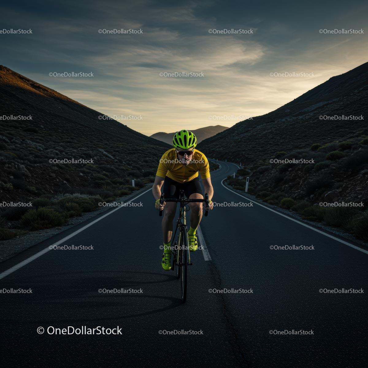 Cyclist on Serene Mountain Road at Sunset