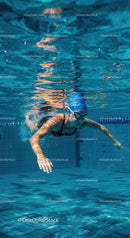 Underwater View of a Female Swimmer in a Pool