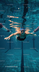 Female Swimmer Freestyle Underwater in a Blue Pool