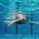 Professional Female Swimmer in Blue Water Pool