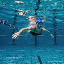 Female Swimmer Gliding Underwater in Blue Pool