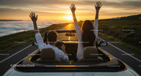 Couple Enjoying Scenic Drive at Sunset in Convertible