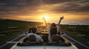 Sunset Drive in Convertible with Raised Hands