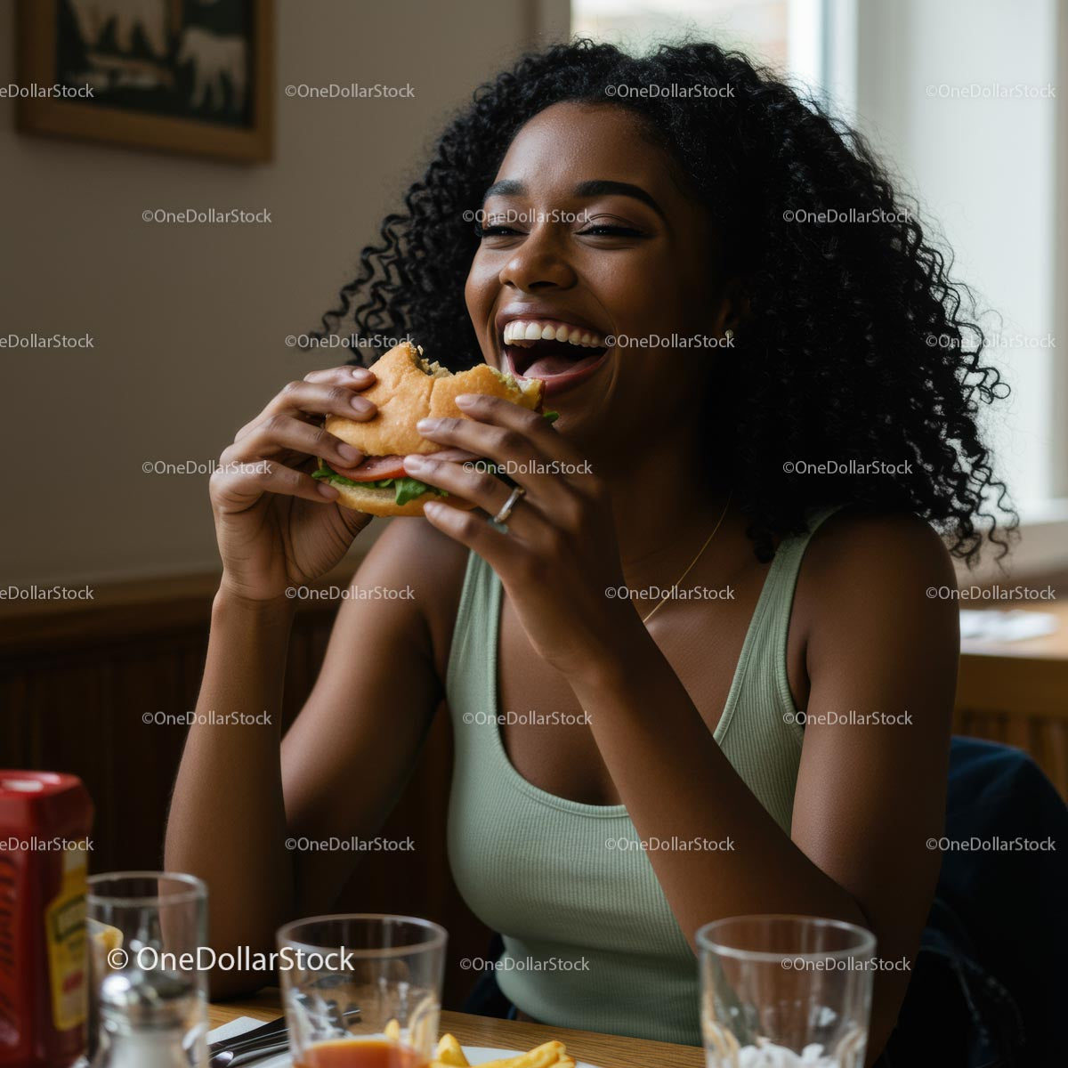 Joyful Woman Savoring a Delicious Burger Indoors