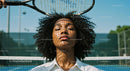 Serene Woman with Tennis Racquet Shadows on Court