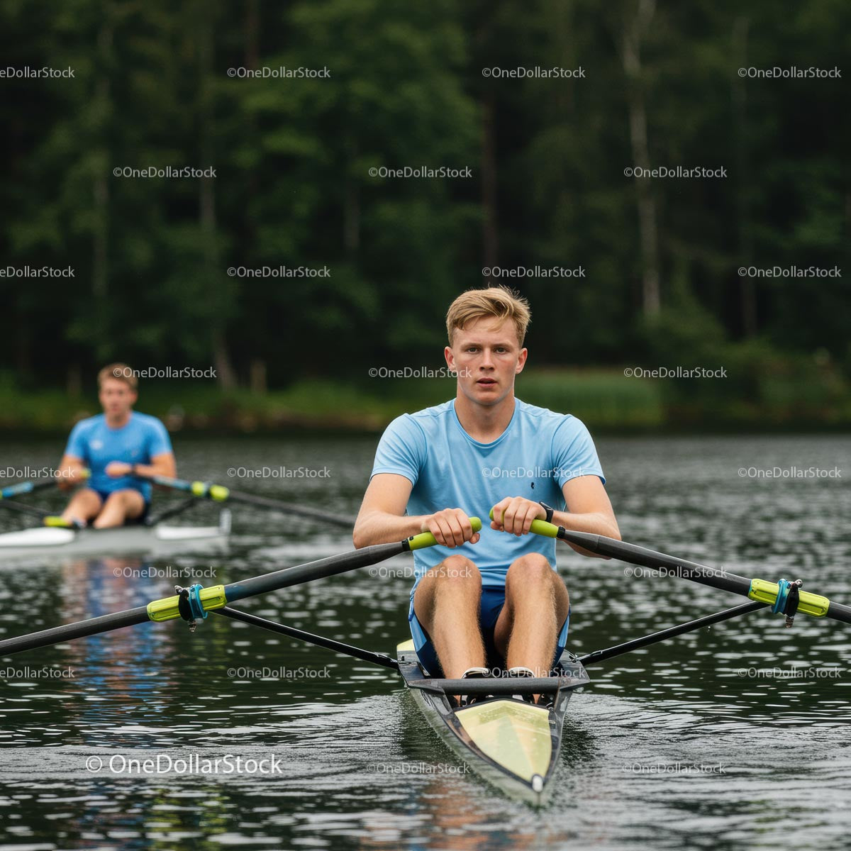 Focused Young Man Rowing on a Calm Lake in Summer