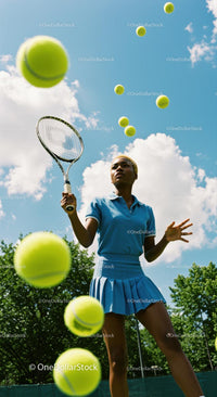 Female Tennis Player Juggling Balls Under Blue Sky