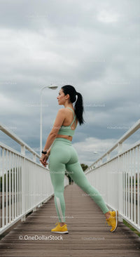 Woman Stretching on Bridge in Mint Green Activewear