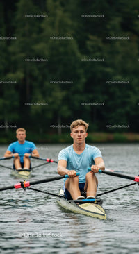 Focused Rowers Racing on a Tranquil Lake