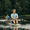 Man Rowing on a Serene Lake in Summer
