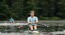 Rowing Athlete in Action on Tranquil Lake