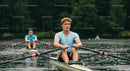 Young Male Rowers Practicing on a Tranquil Lake