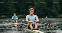 Young Male Rowers Practicing on a Tranquil Lake