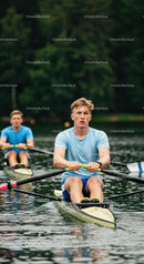 Young Rowers in Action on Tranquil Lake