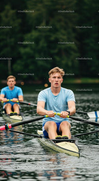 Young Rowers in Action on Tranquil Lake