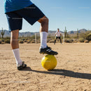 Desert Soccer Game with Yellow Ball and Cactus Background