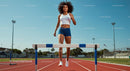 Female Athlete Hurdling at Outdoor Track