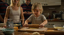 Blond Child Rolling Dough in Cozy Family Kitchen