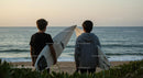 Young Surfers at Sunset on a Serene Beach