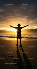 Silhouette of Traveler Embracing Sunset on Beach