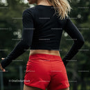 Athletic Woman in Red Shorts Preparing for Outdoor Workout