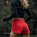 Female Runner in Red Shorts Preparing for Outdoor Exercise