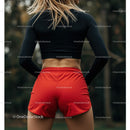 Athletic Woman in Red Shorts Preparing for Outdoor Workout