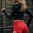 Athletic Woman Jogging in Red Shorts and Black Top