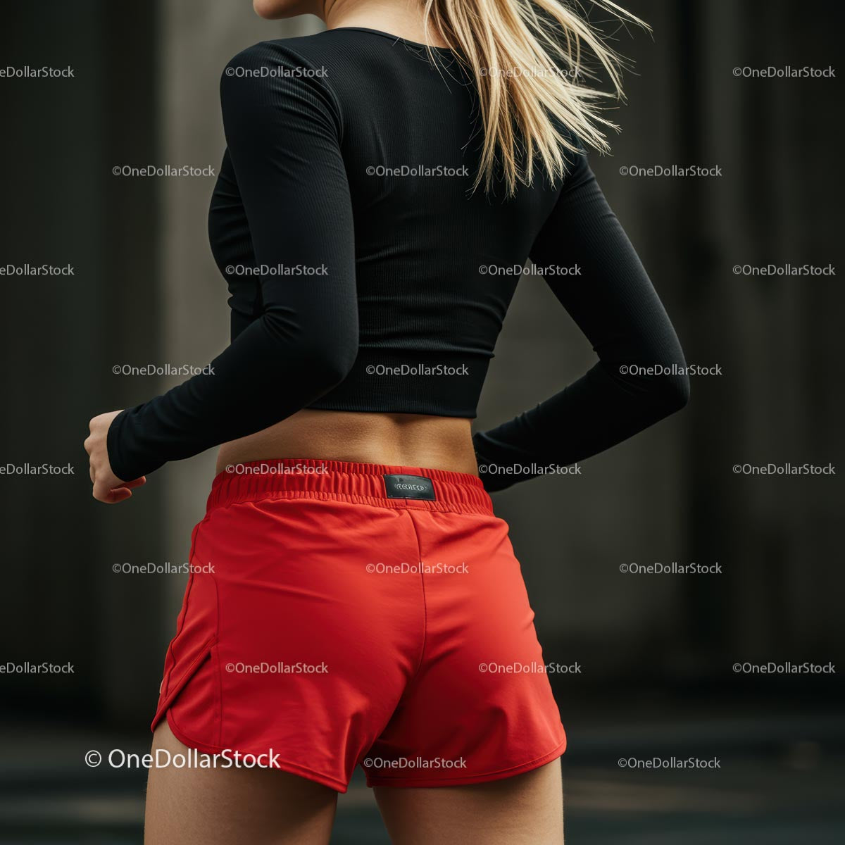 Athletic Woman in Red Shorts Preparing for Outdoor Workout