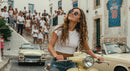 Carefree Woman Enjoying a Ride on Vintage Scooter
