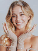 Smiling Blonde Woman in Cozy Knitted Gloves
