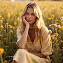 Young Woman in a Sunlit Meadow with Vibrant Wildflowers