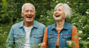 Senior Couple Laughing Together in a Green Garden