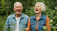 Senior Couple Laughing Together in a Green Garden