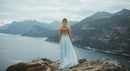 Woman in Blue Dress Overlooking Mountainous Landscape