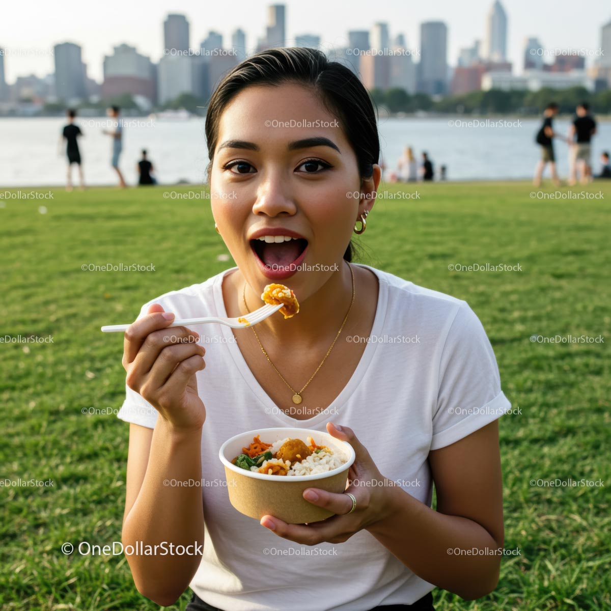 Woman Enjoying a Picnic Meal in Urban Park Setting