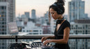 DJ Mixing Music at a Rooftop Party with City Skyline