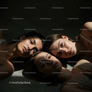 Artistic Portrait of Three Women in Dramatic Light
