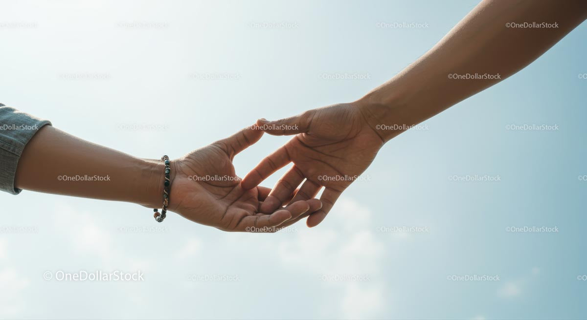 Hands Reaching Out Under Clear Blue Sky