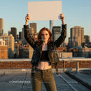 Confident Young Woman Holding Blank Sign on Rooftop
