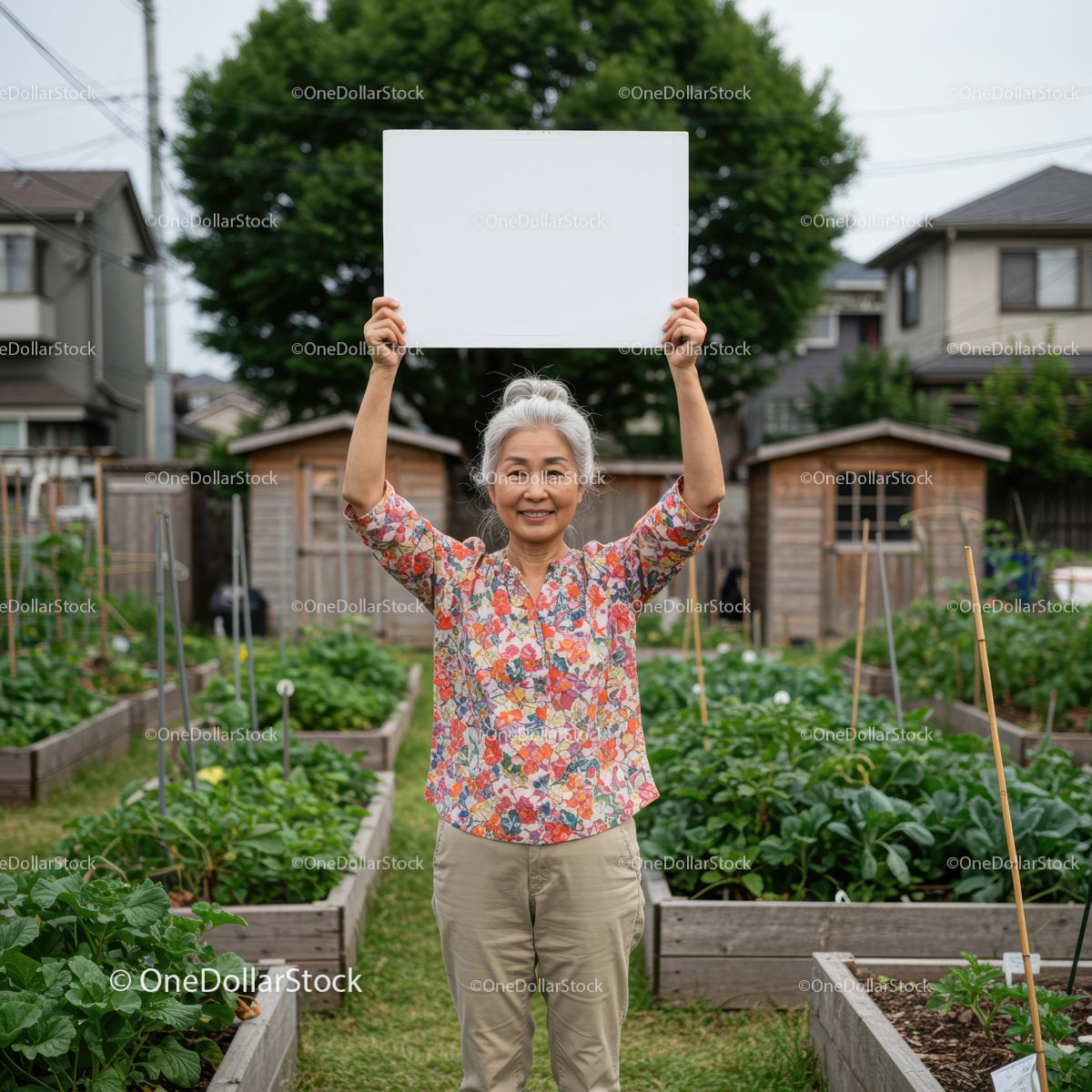 Smiling Senior Woman Holding Sign in Community Garden