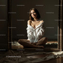 Woman in White Shirt Reflecting in Mirror with Soft Light