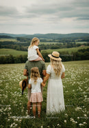 Family Enjoying a Summer Day in a Scenic Countryside