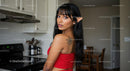 Woman with Elf Ears and Tattoo in Modern Kitchen