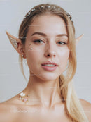 Ethereal Woman With Elf Ears and Delicate Floral Jewelry