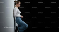Fashionable Woman in Denim and White Against Dark Background
