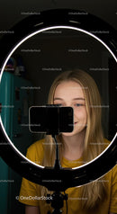 Young Woman Recording with Smartphone and Ring Light