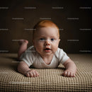 Adorable Baby Lying on Soft Beige Blanket