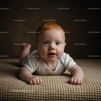 Adorable Baby Lying on Soft Beige Blanket